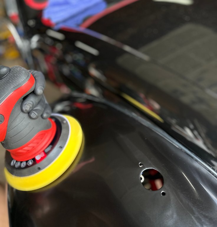 Ceramic coating application being applied to vehicle paint surface for long-term protection