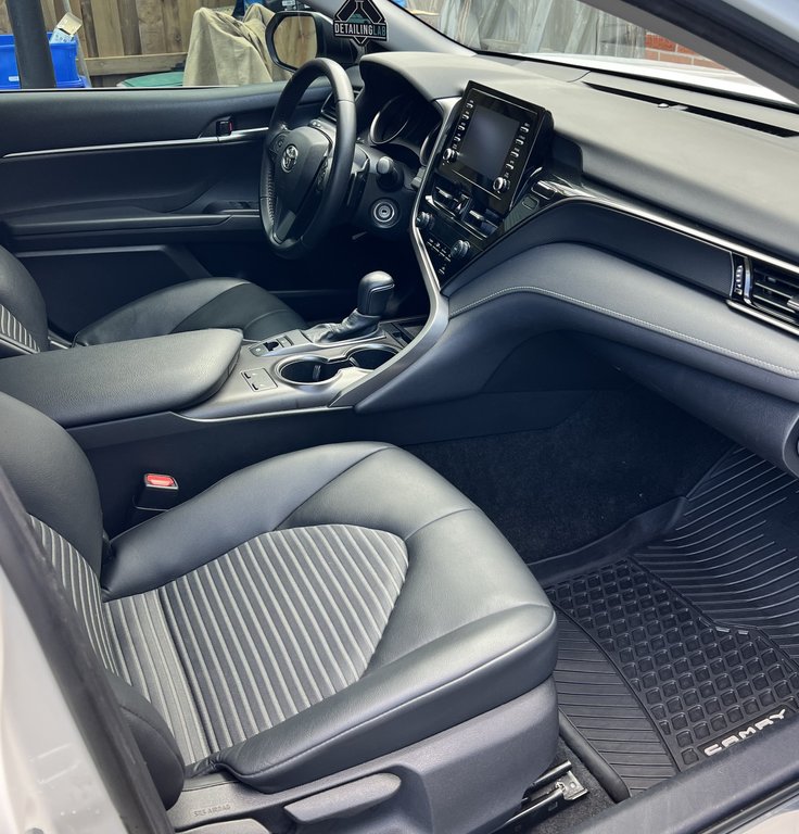 Vehicle interior showing deep cleaning and leather conditioning results