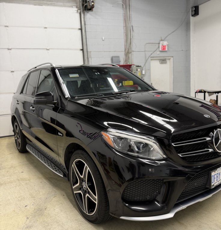 Mercedes GLE 43 AMG SUV receiving professional exterior wash and protection